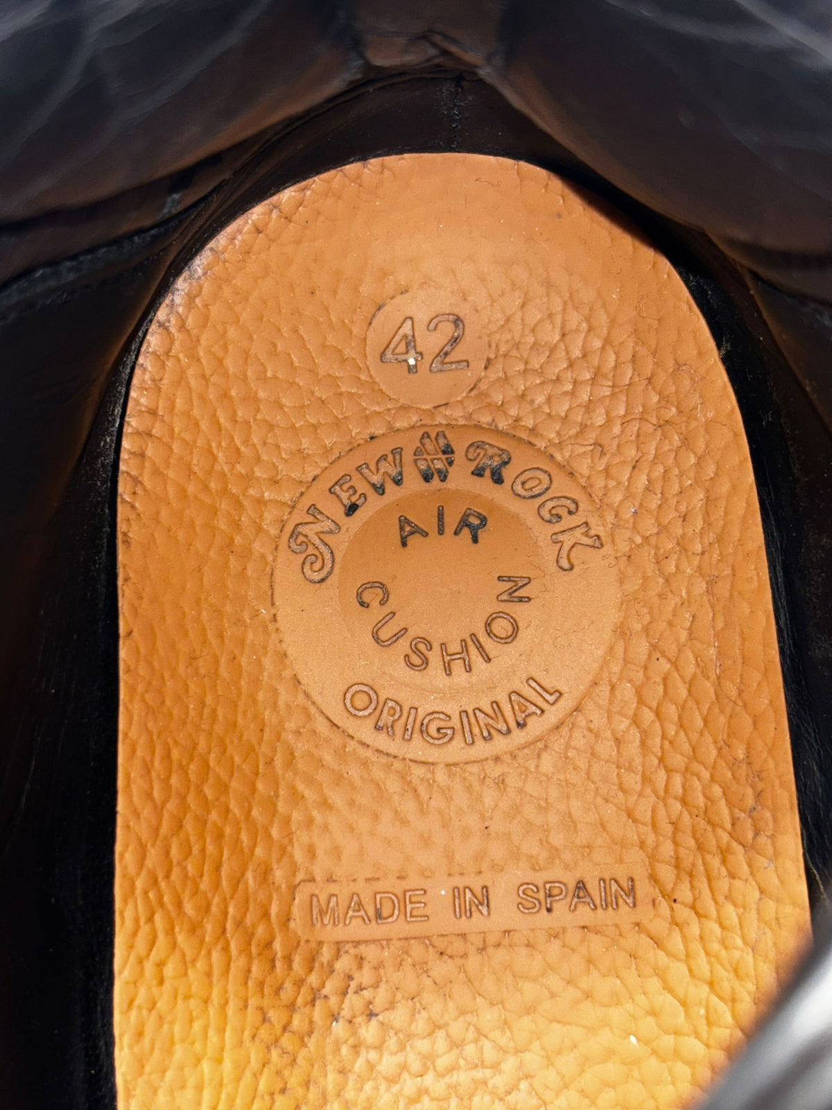 Black platform boot insole close-up with “New Rock” branding and “Made in Spain” text
