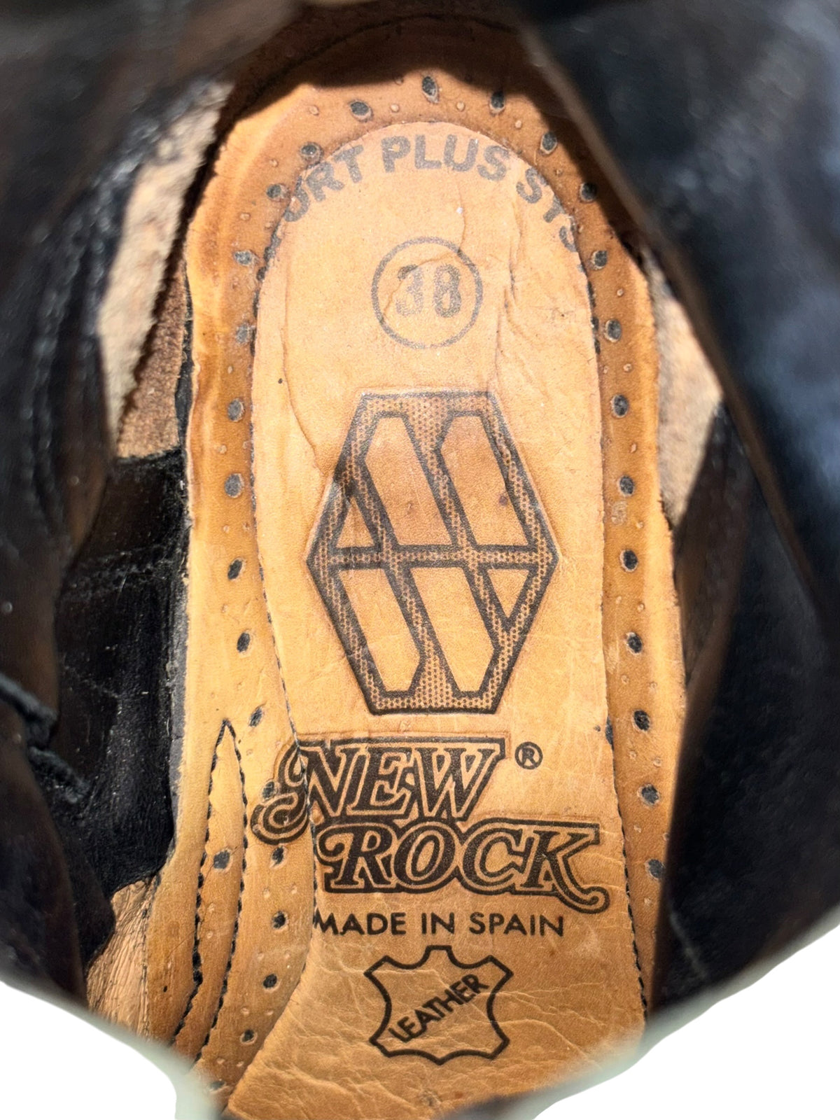 Inside view of vintage platform boots, tan leather insole with New Rock branding