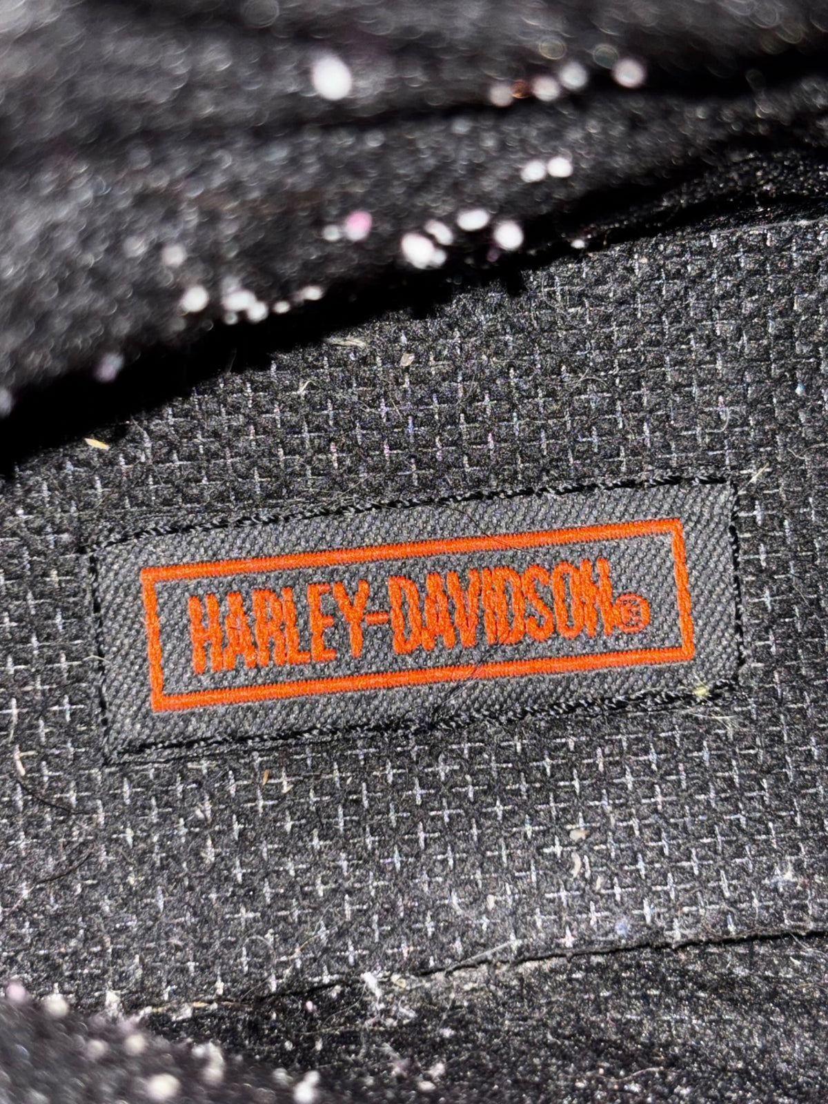 Harley-Davidson leather boot interior label patch with orange border and text
