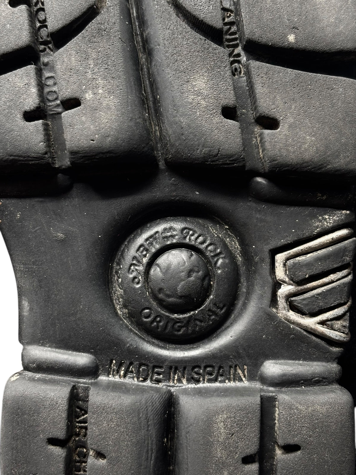 Platform boot upper with eyelets and embossed round logo, dark textured finish