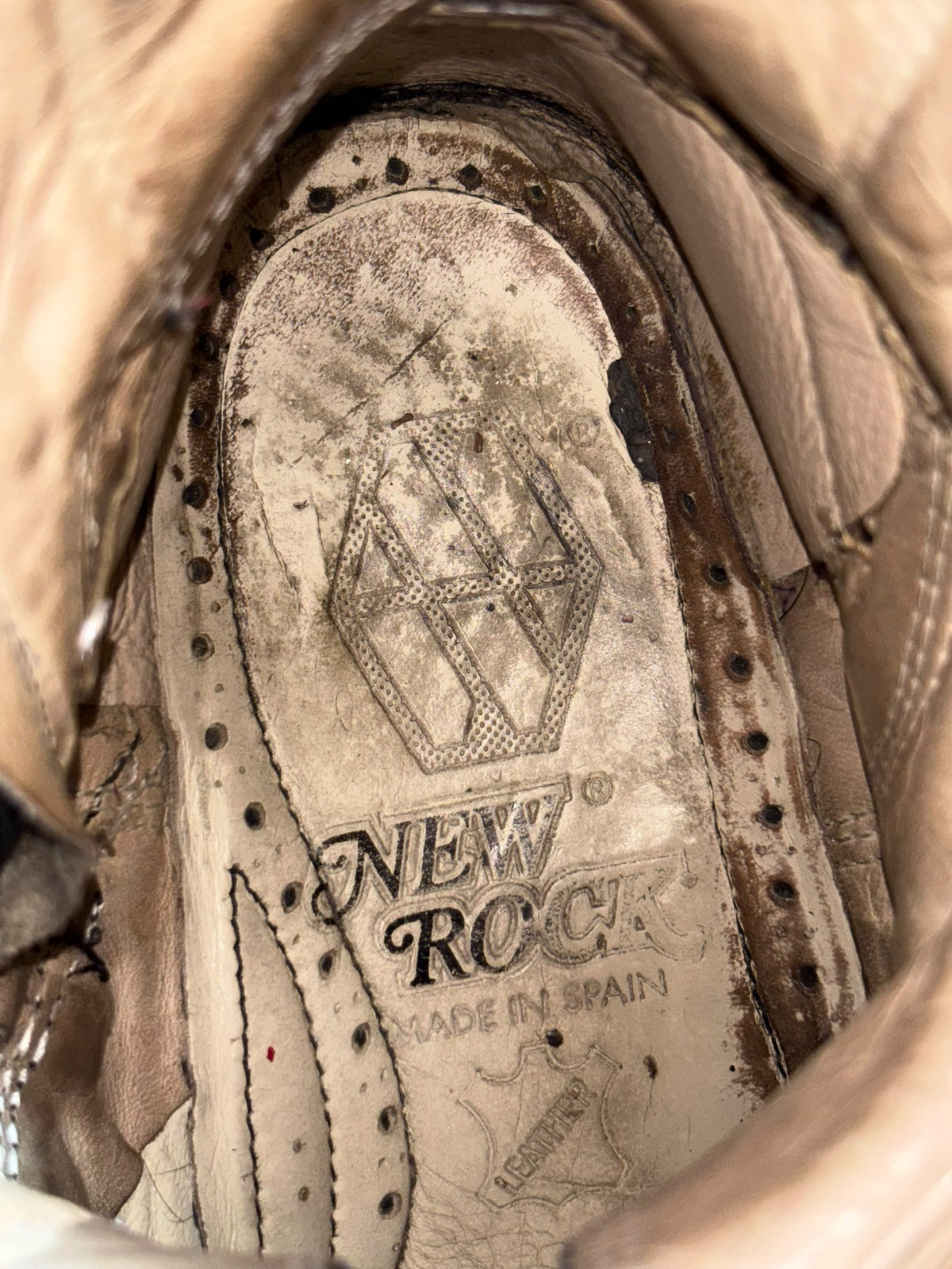 Mid-calf reactor boots insole with “NEW ROCK” logo and “MADE IN SPAIN” label
