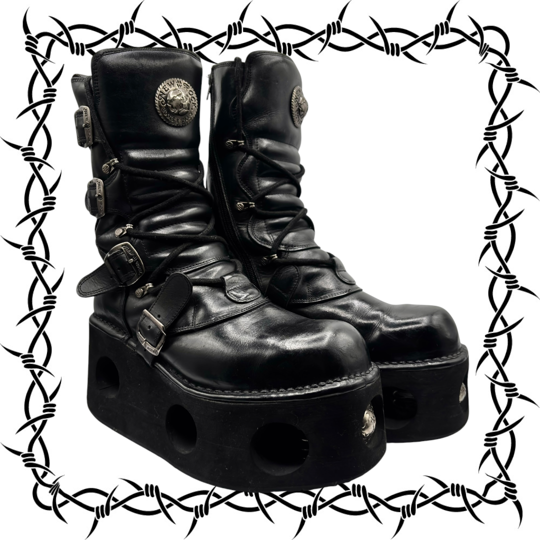 Black leather lace-up platform boots with buckles and round metal logo on shaft