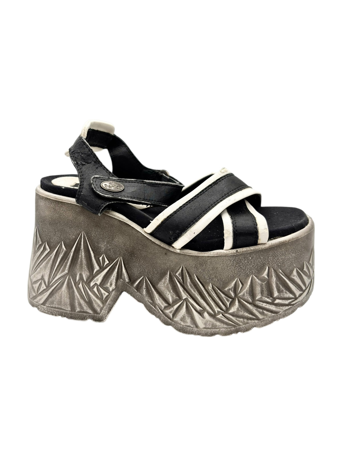Strappy black platform sandals with white trim and silver geometric raised sole