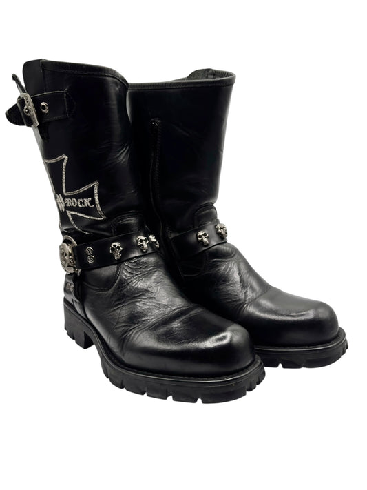 Black leather biker boots with metal buckle strap and chunky tread sole, side view.