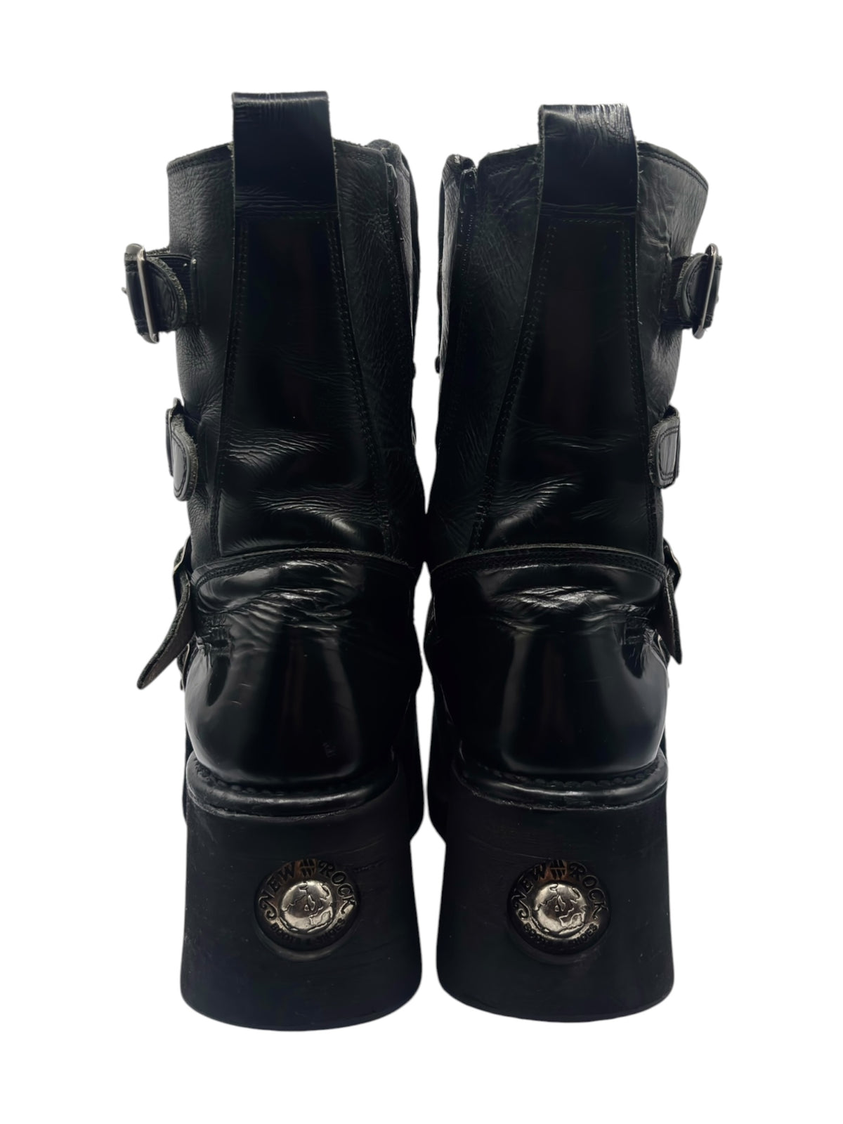 Black mid-calf platform boots, back view with ankle buckles and straps