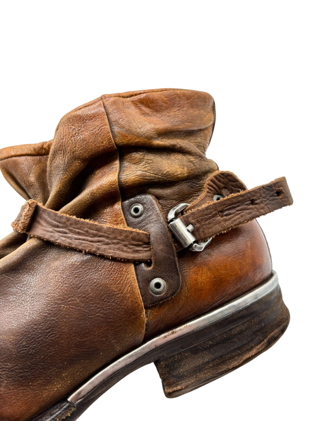 Brown leather ankle boots with lace-up eyelets and fold-over cuff