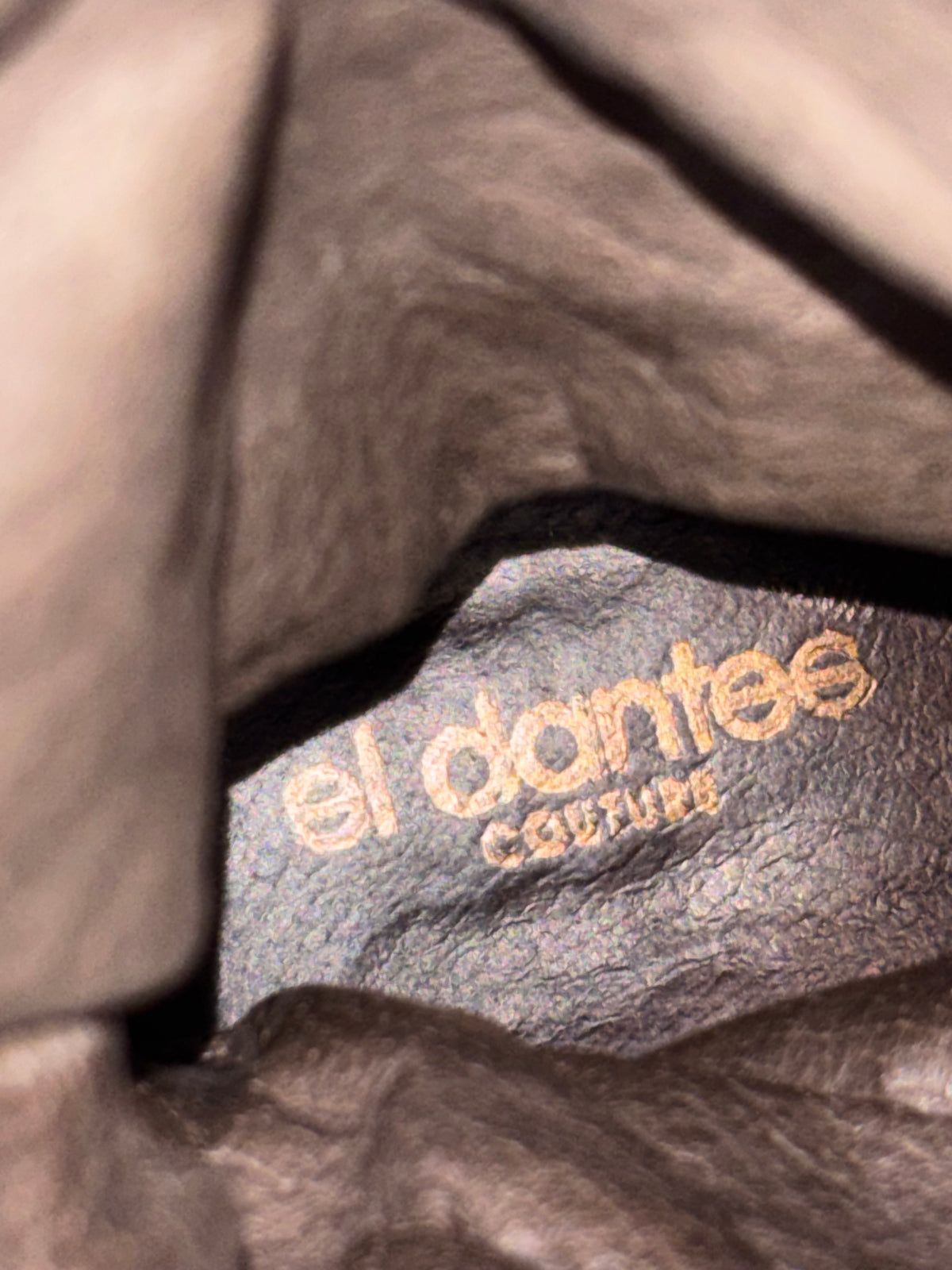 El Dantes logo on brown suede lining inside boot