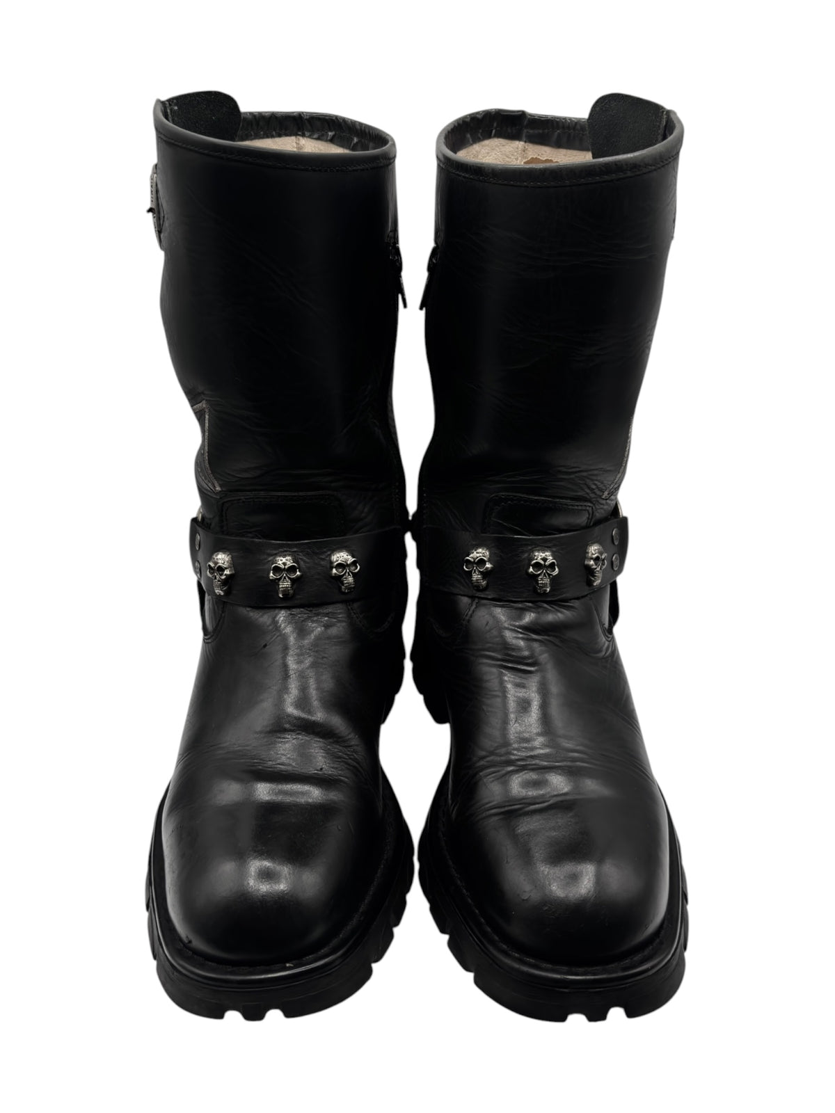 Black leather biker boots, side view with studded strap and metal buckle