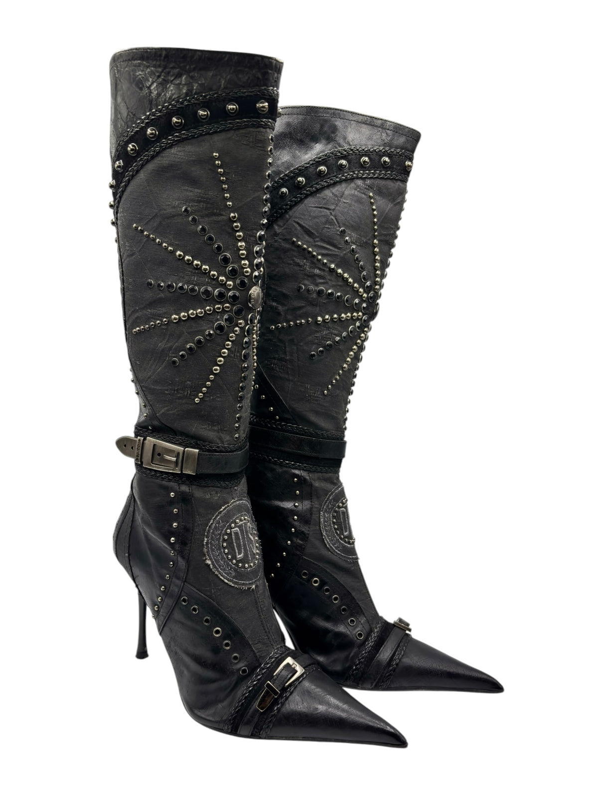 Knee-high vintage boots with side buckle straps, stud trim, and pointed toe