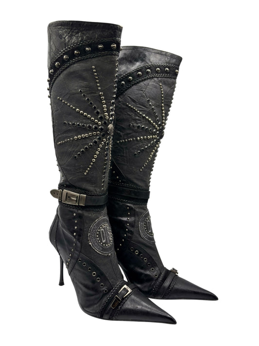 Knee-high vintage boots with side buckle straps, stud trim, and pointed toe