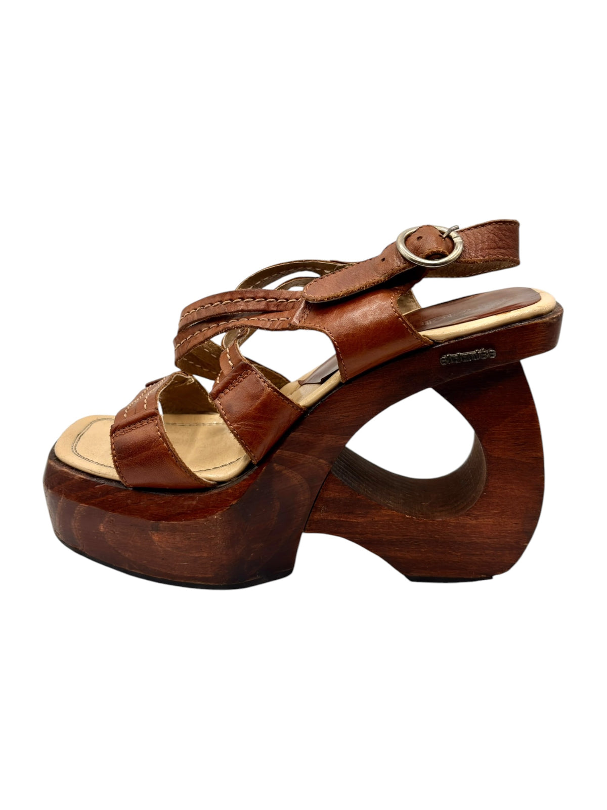 Brown leather platform sandal with wide straps, buckle closure, and beige footbed