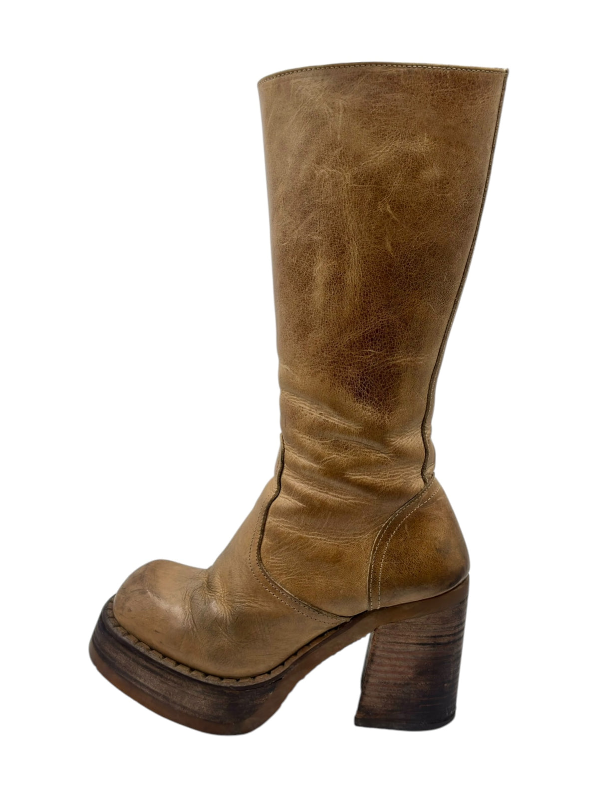 Tan knee-high block heel boots with side zipper and distressed leather upper.