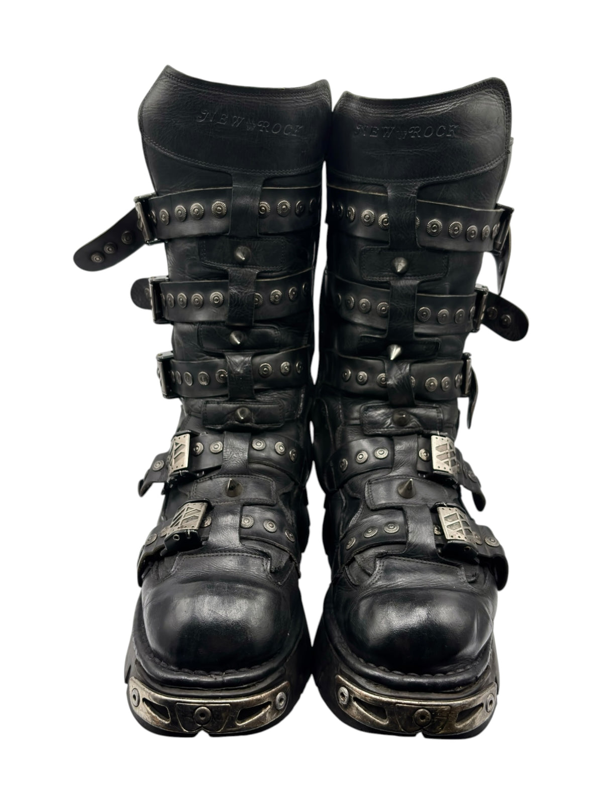 Black studded leather platform boots with strap details and metal buckles