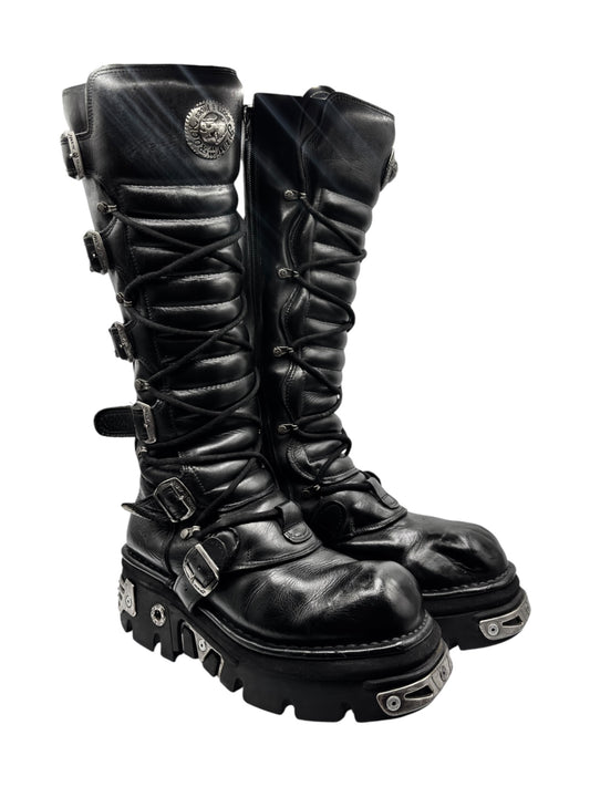 Knee-high lace-up boots with side buckles and chunky tread sole, black