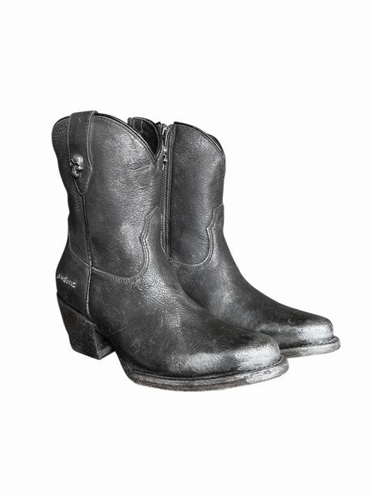 Black leather cowboy boots side view with rounded toe and low heel