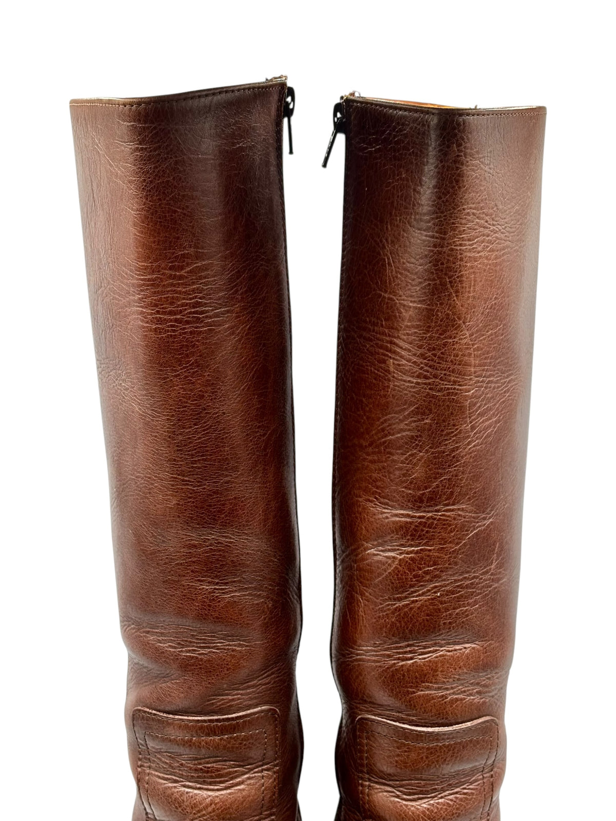 Pair of brown knee-high boots with center zipper opening and shafts.