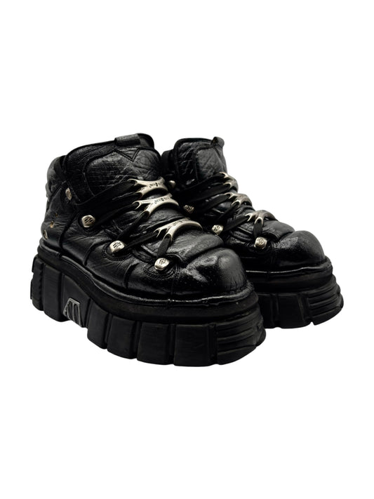 Black New Rock platform boots with lace-up front and rugged tread sole