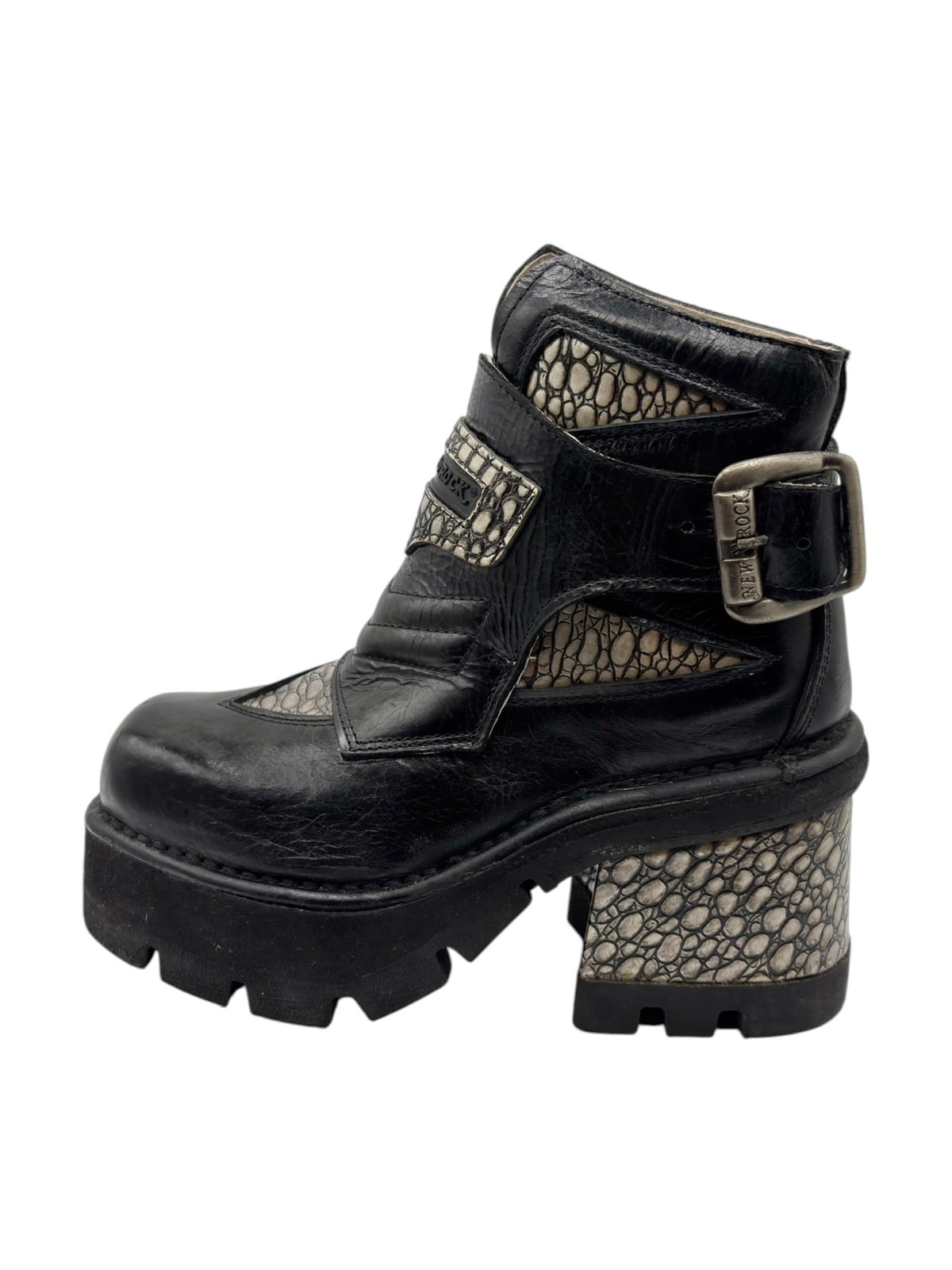 Black leather platform ankle boot with buckle strap and contrasting textured side panels.