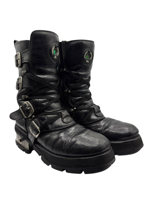 Black mid-calf leather lace-up boots with side buckles and adjustable straps
