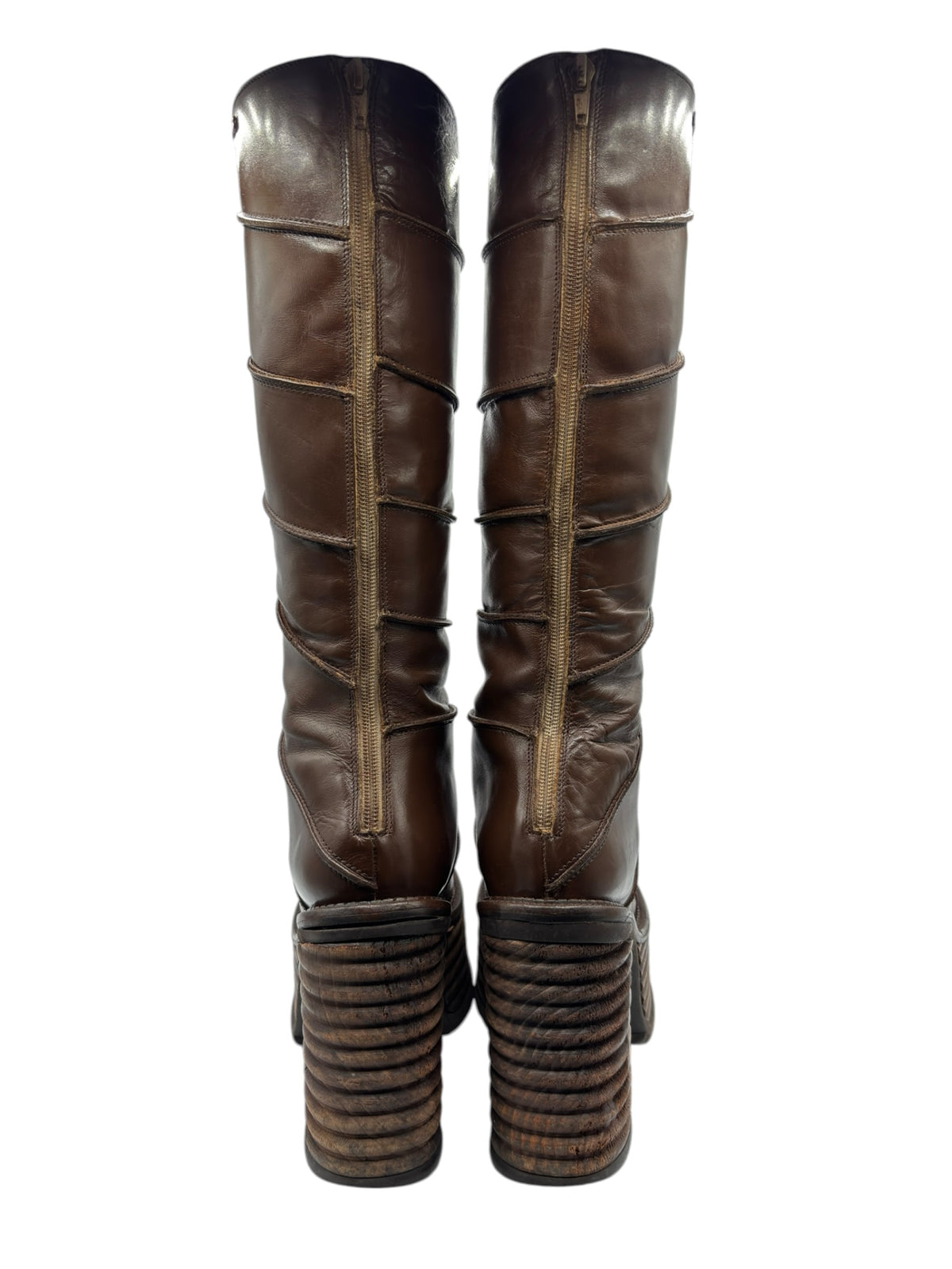 Pair of brown knee-high platform boots with straight shaft and stacked block heels