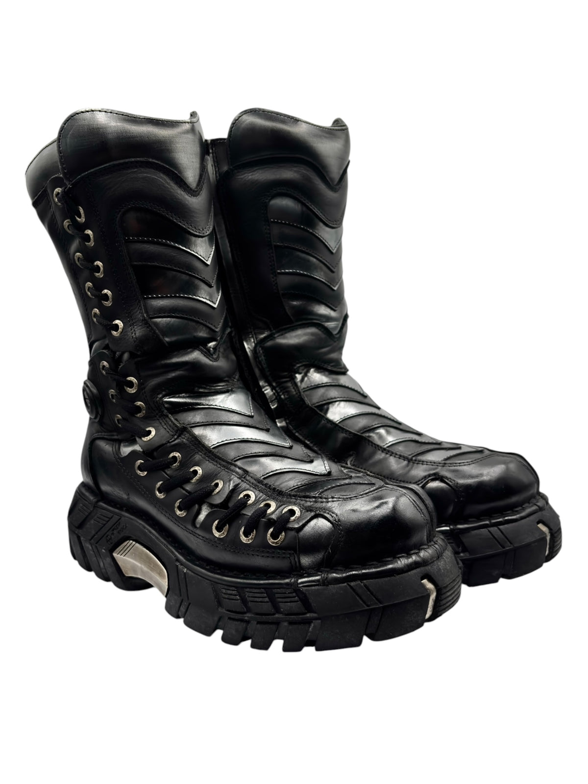Black lace-up platform boots with chevron trim and rugged tread sole