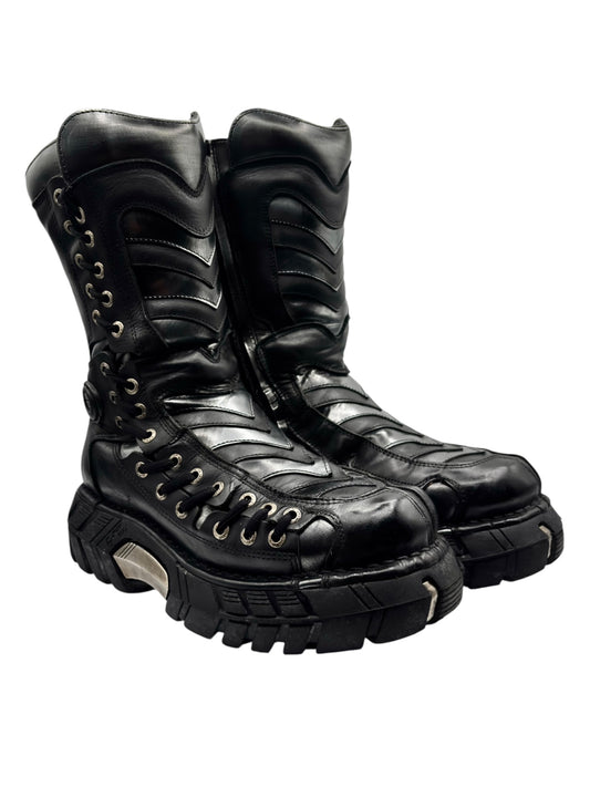 Black lace-up platform boots with chevron trim and rugged tread sole