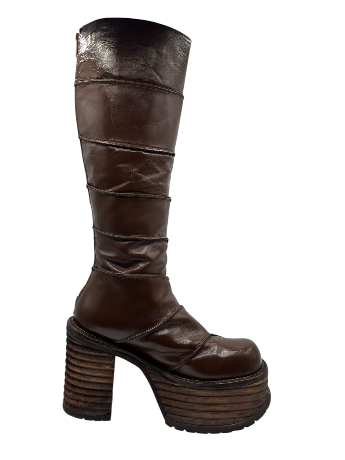 Brown knee-high boots with ruched stitched panels and thick stacked block heel