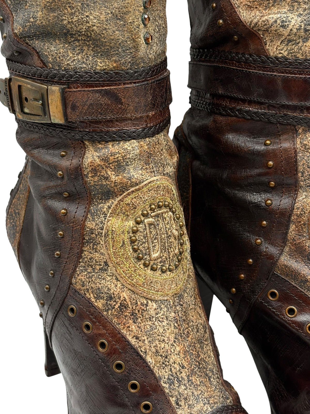 Knee-high boots, distressed gold foot panel with studded emblem, dark brown shaft and eyelets