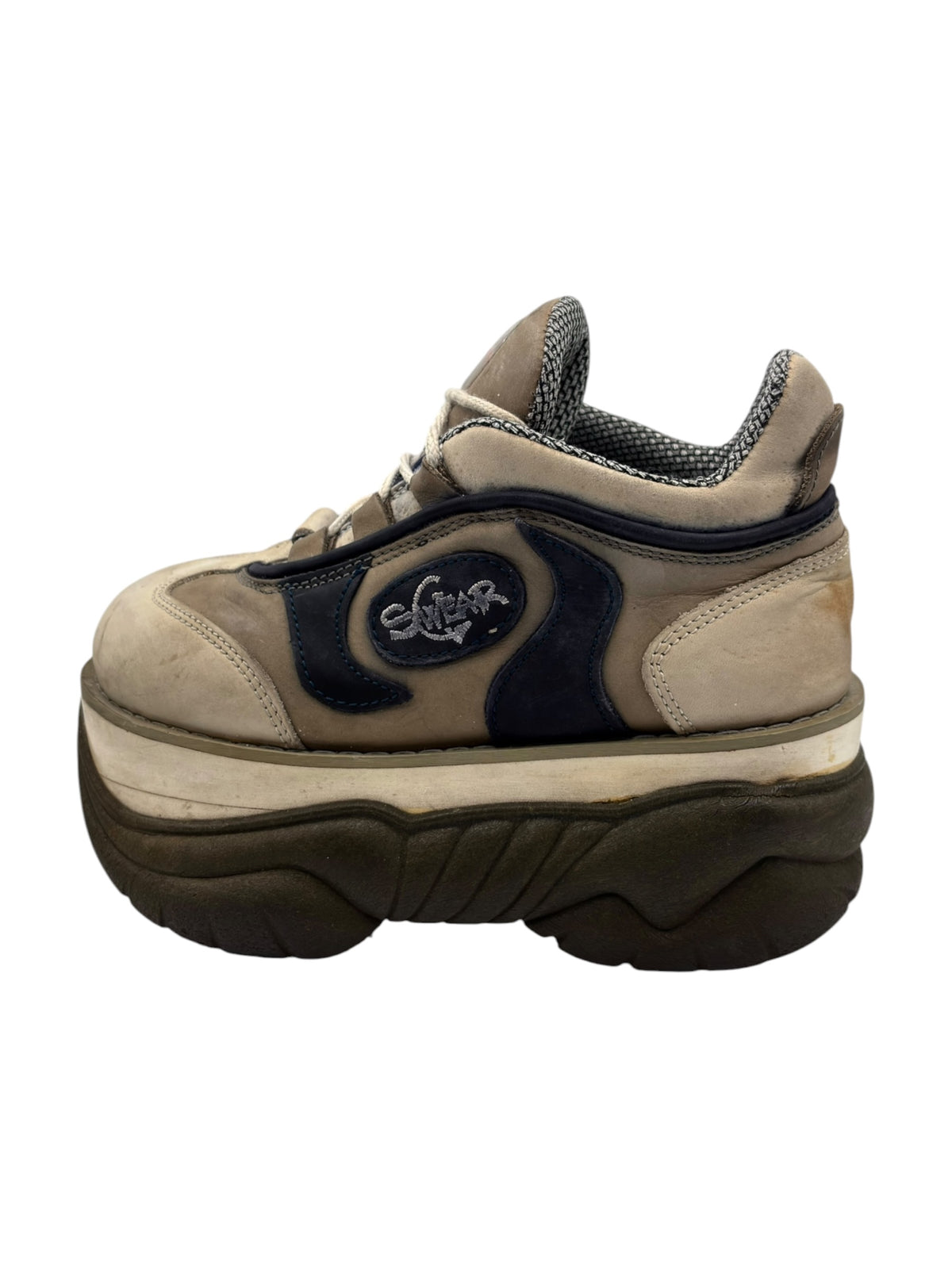 Beige platform lace-up boot with navy side panels and thick dark sole