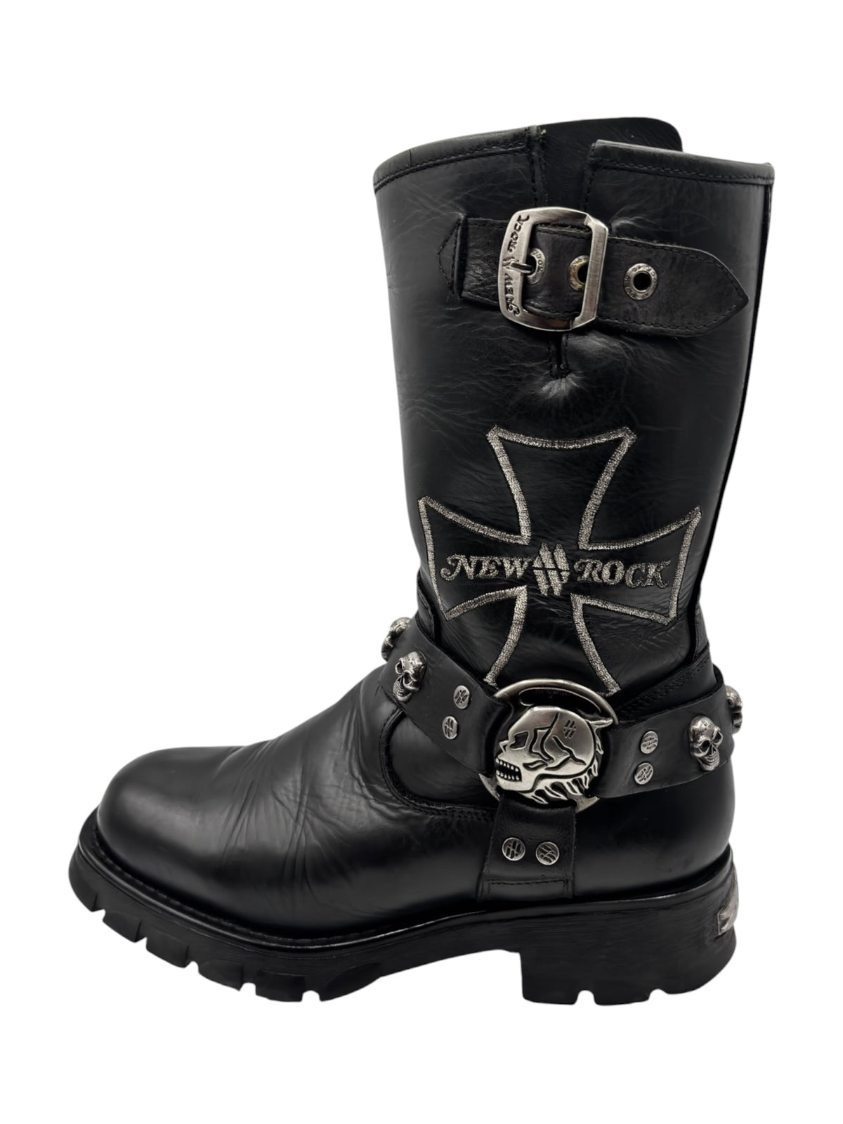 Black leather biker boots with cross-stitched emblem, buckle strap, skull accents