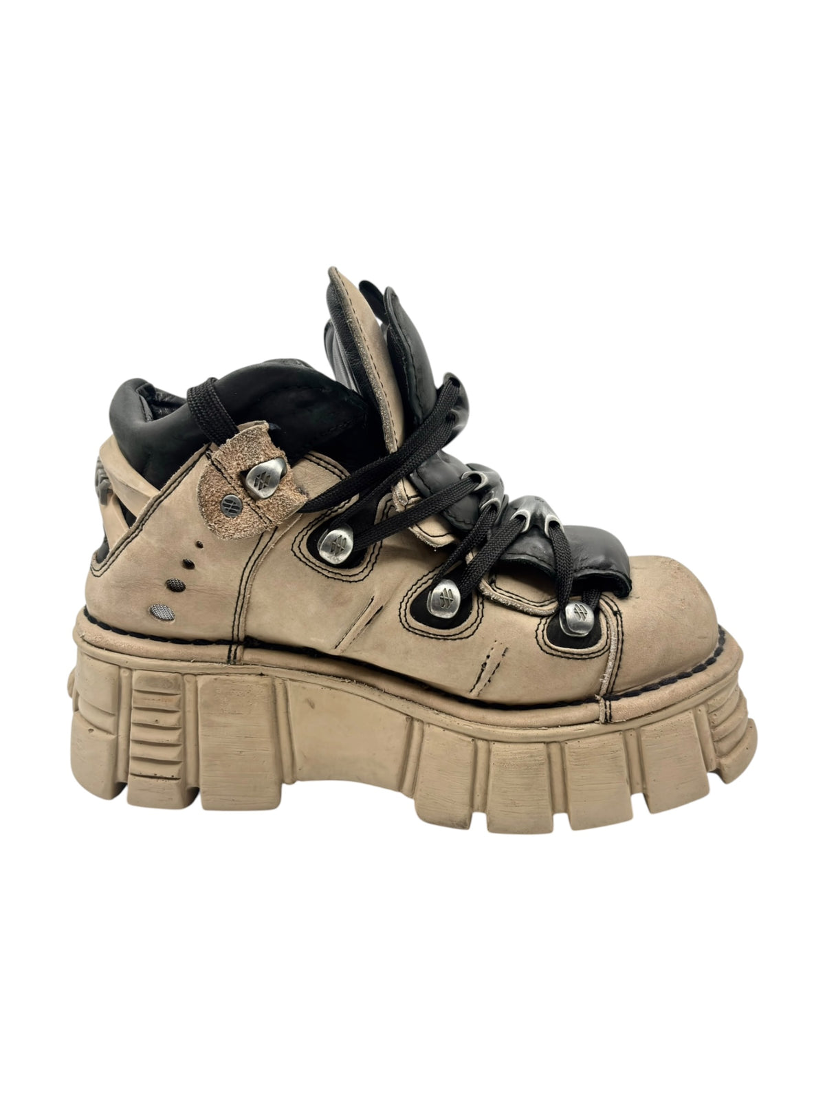 Beige and black lace-up platform boots with padded collar and side eyelets