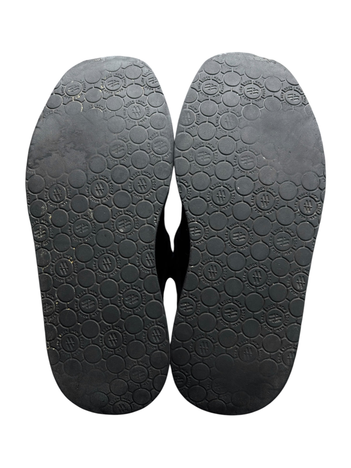 Pair of black platform boot outsoles with circular tread pattern