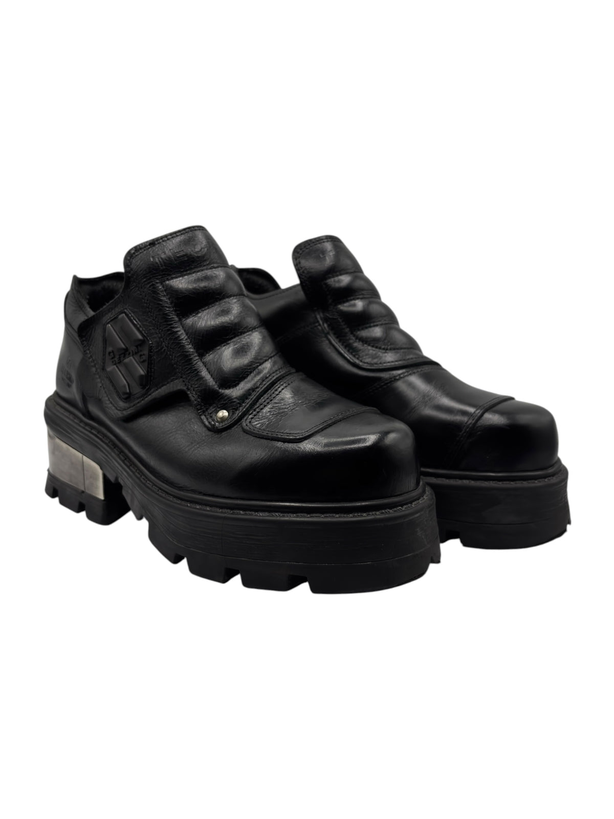 Pair of black ankle platform boots with chunky tread and double strap details