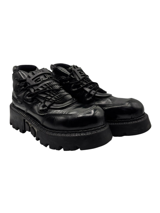 Black leather lace-up platform boots with chunky tread sole and thick heel