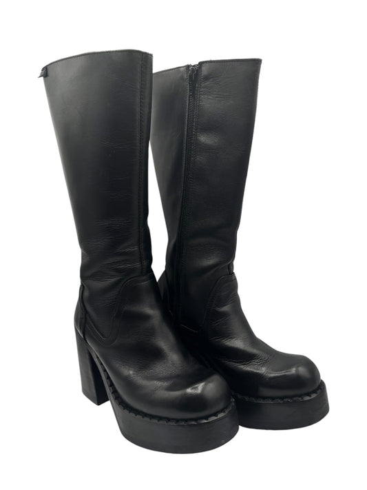 Black knee-high platform boots with block heel and seam detail