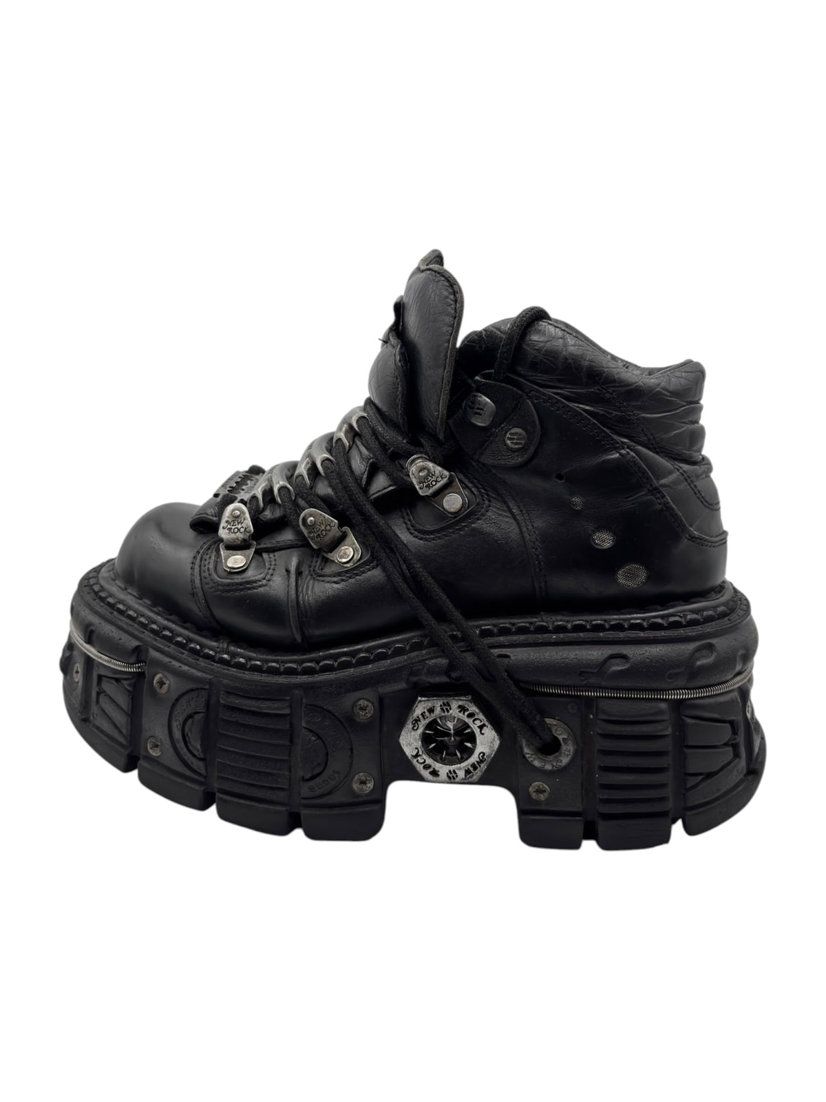 Black platform ankle boots with laces and stacked sole, side view.