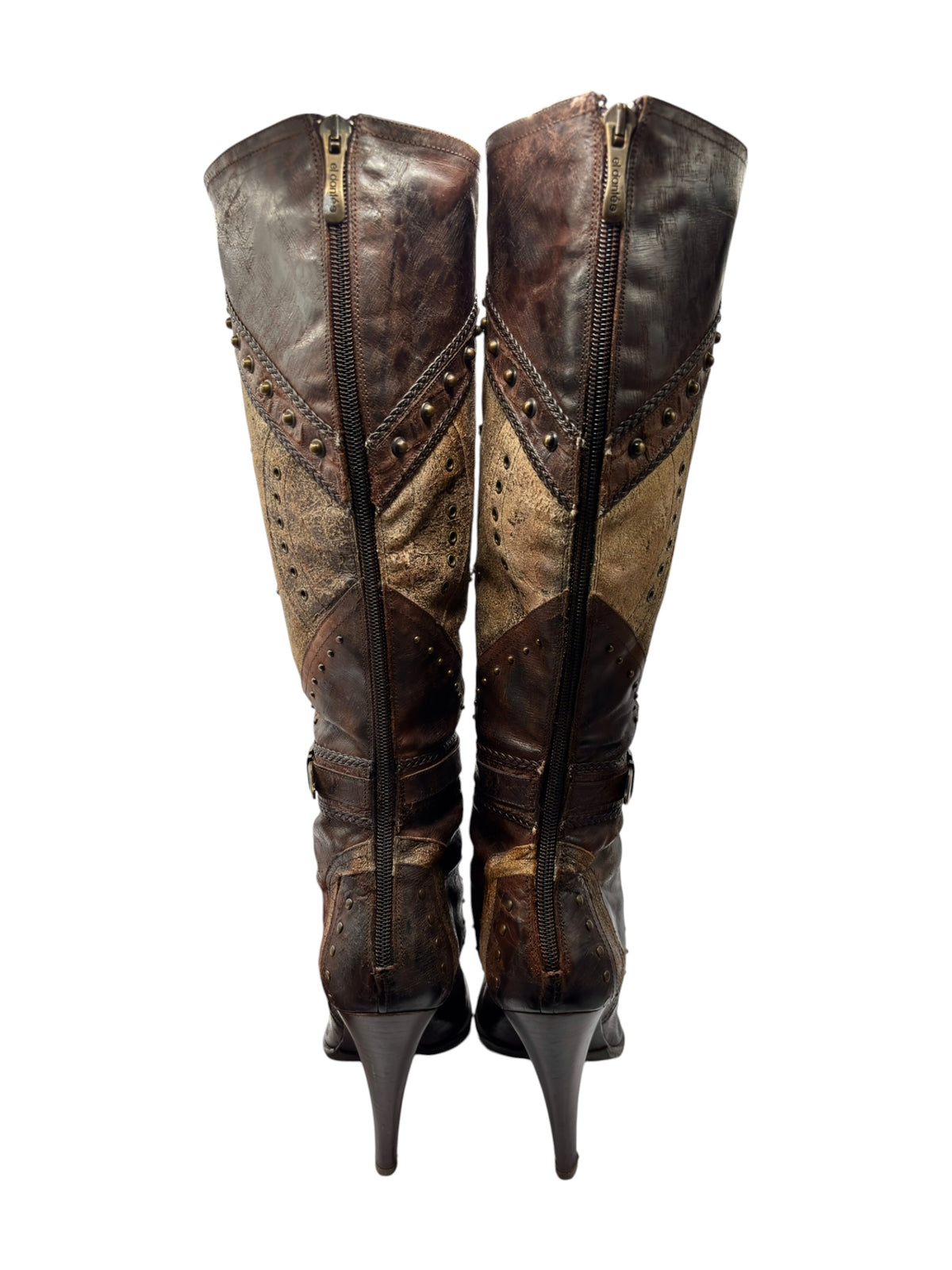 Knee-high leather boots front view with two zippers and decorative perforation panels
