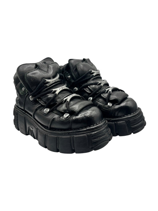 Black leather-look lace-up platform boots with thick sole and side tread blocks