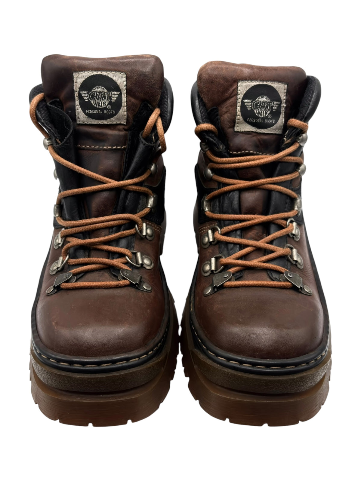 Brown leather lace-up boots with metal eyelets, padded collar, and chunky lug sole