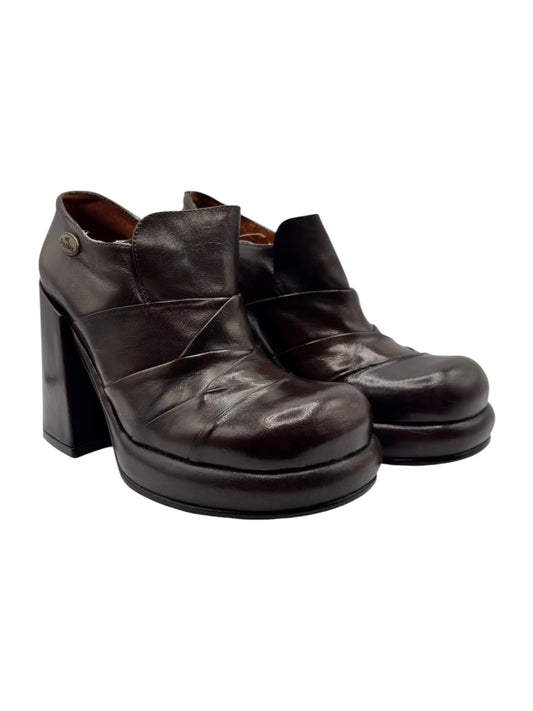 Dark brown leather heeled slip-on shoes with stacked heel and front panel stitching