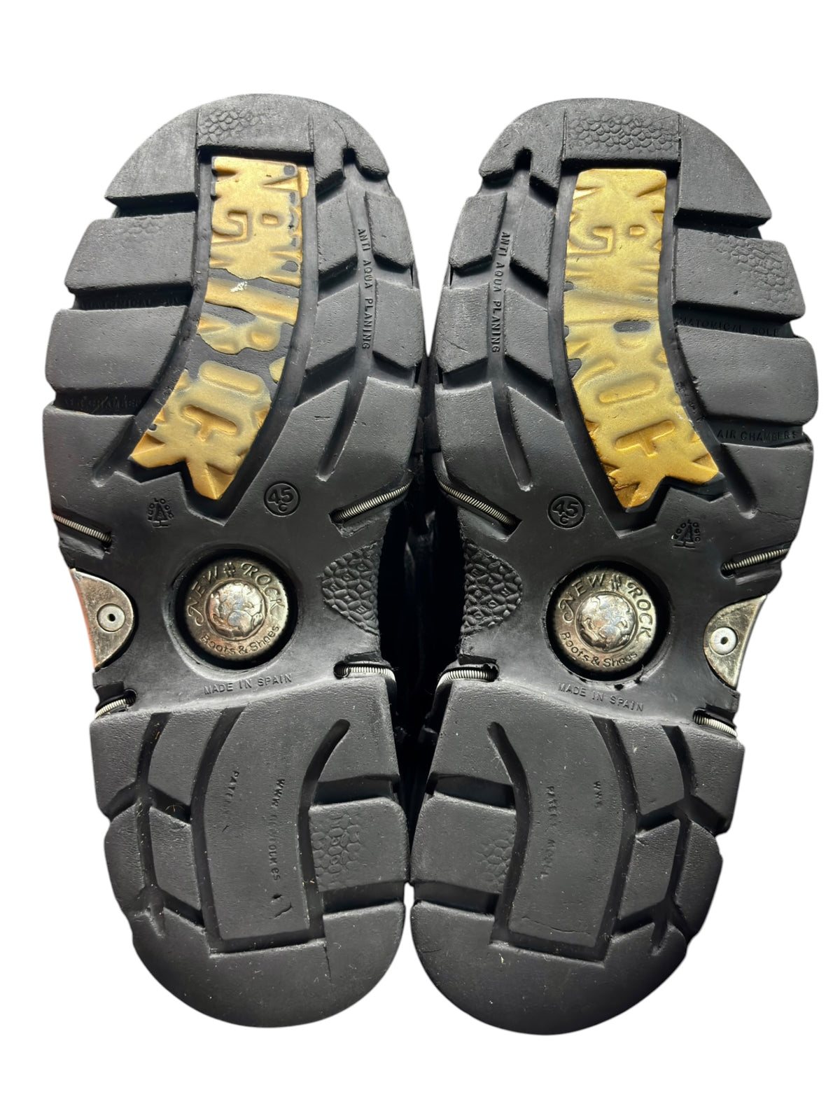 Pair of platform boot outsoles with yellow tread inserts and embossed details