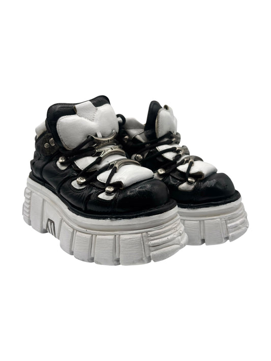 Black and white platform lace-up boots angled side view
