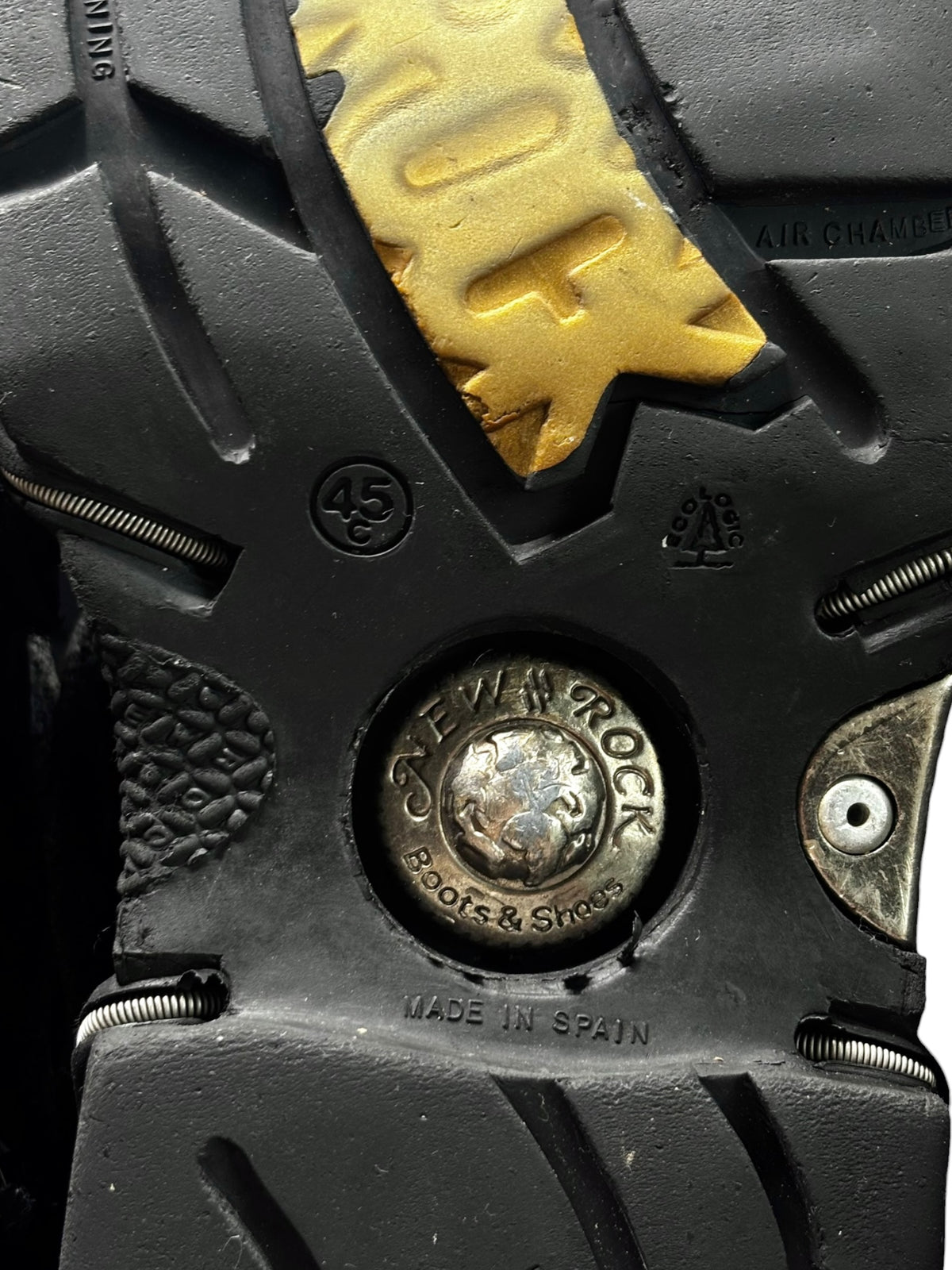 Platform boot outsole with chunky tread, circular size 45 mark, and studs