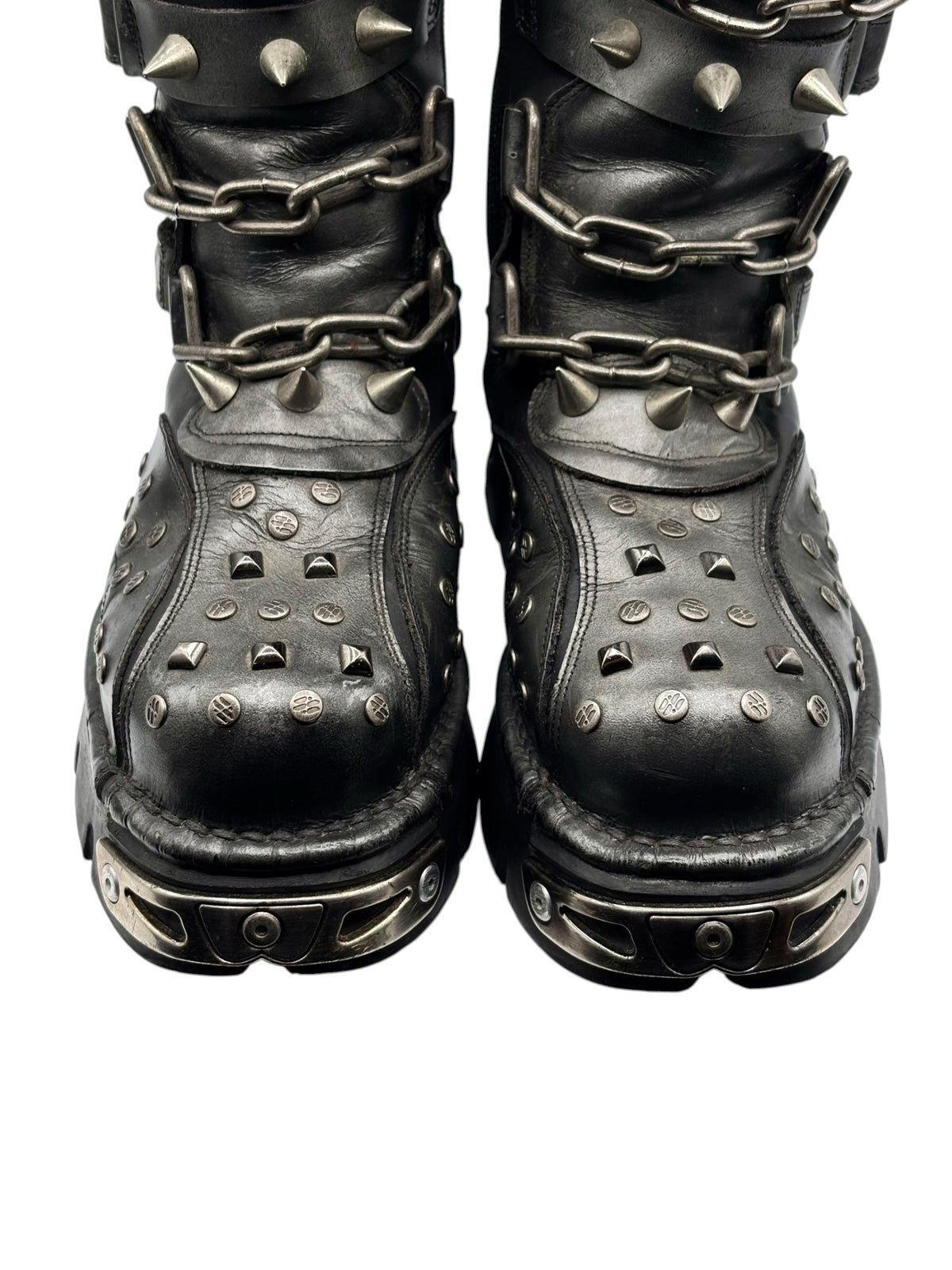 Grey studded leather chain boots, side view with metal spikes and ankle straps