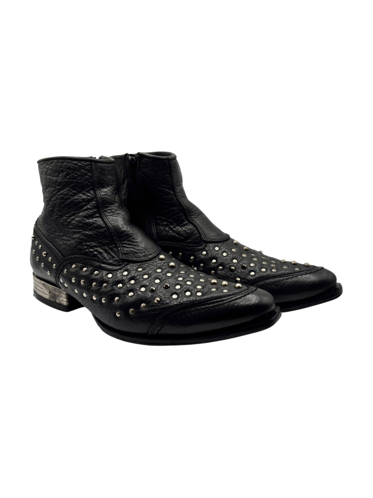 Black leather cowboy boots with metal studs on toe and sides, ankle height