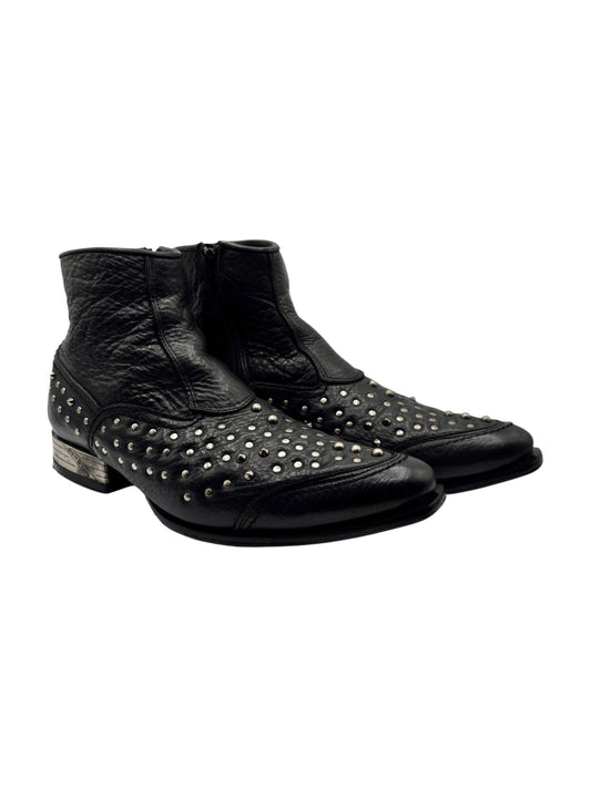 Black leather cowboy boots with metal studs on toe and sides, ankle height