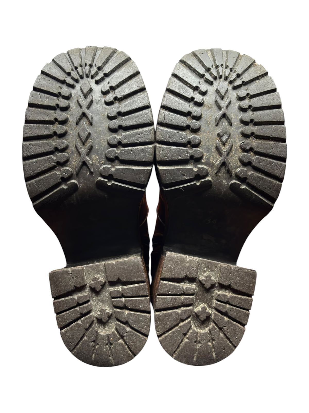 Brown leather boot outsoles with round-toe tread and diamond groove pattern