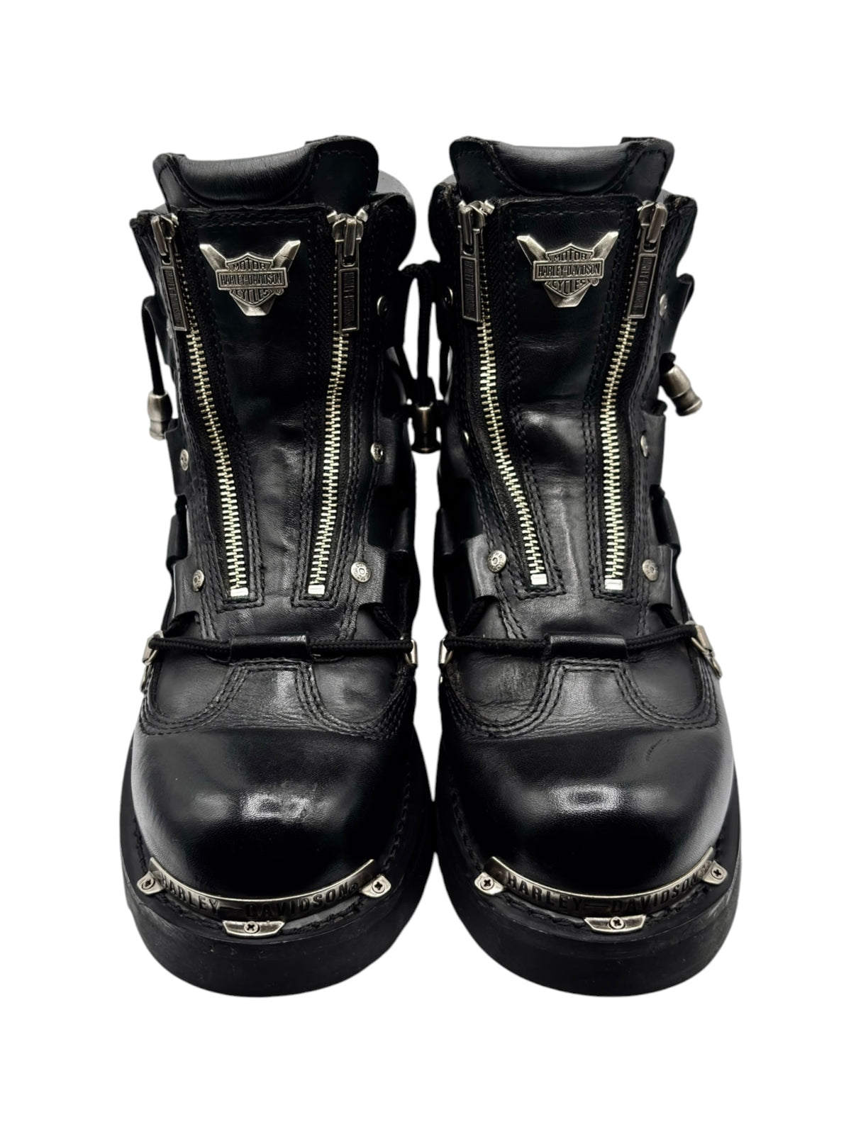 Pair of black leather biker boots with double front zippers and metal logo tabs