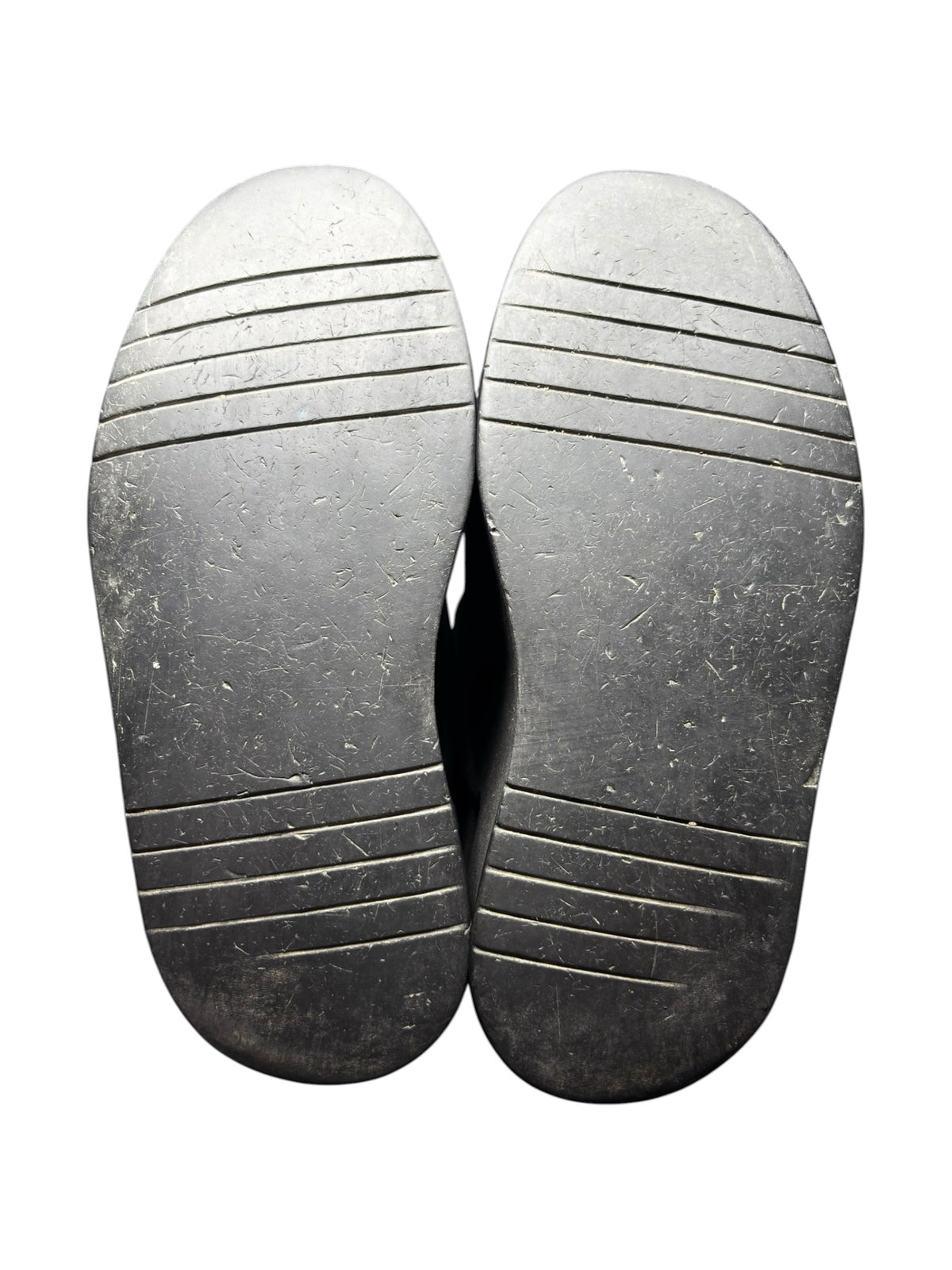 Pair of black platform boot outsoles with linear tread grooves