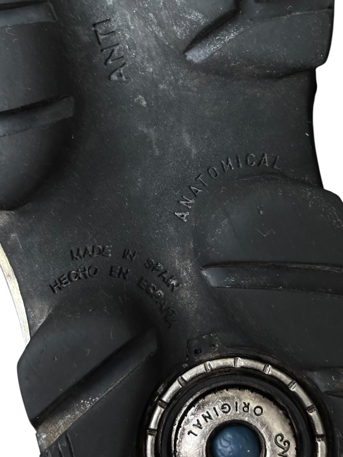Vintage New Rock boot outsole with molded tread and round logo plate